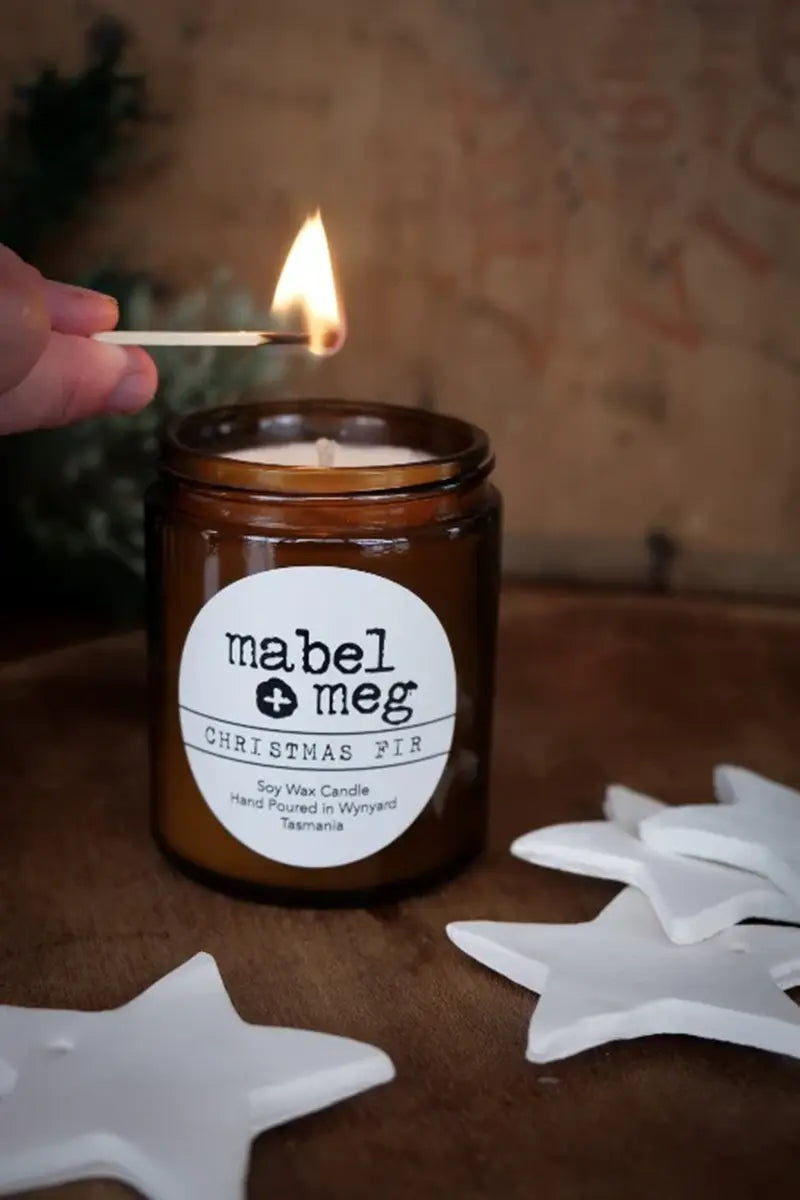 Image of the Scented Candle by Mabel + Meg in Christmas Fir Classic being lit