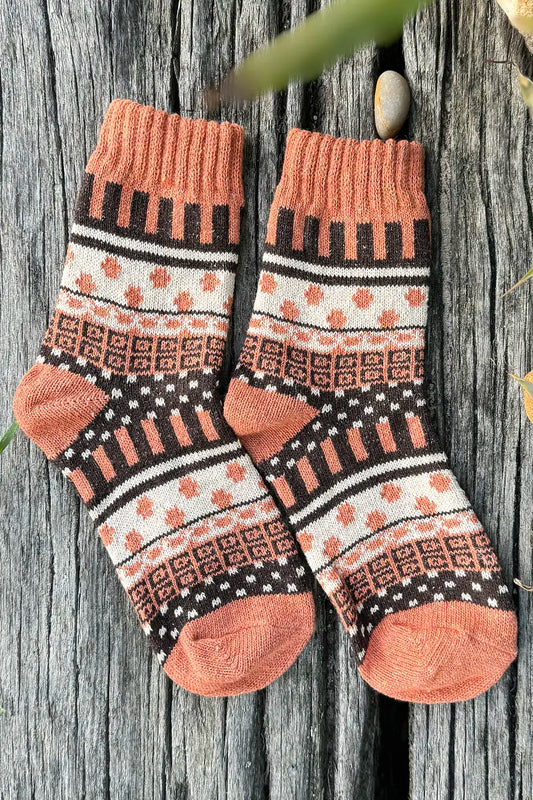 Nordic Style Socks in Burnt Orange Cross by Mabel + Meg pair on driftwood