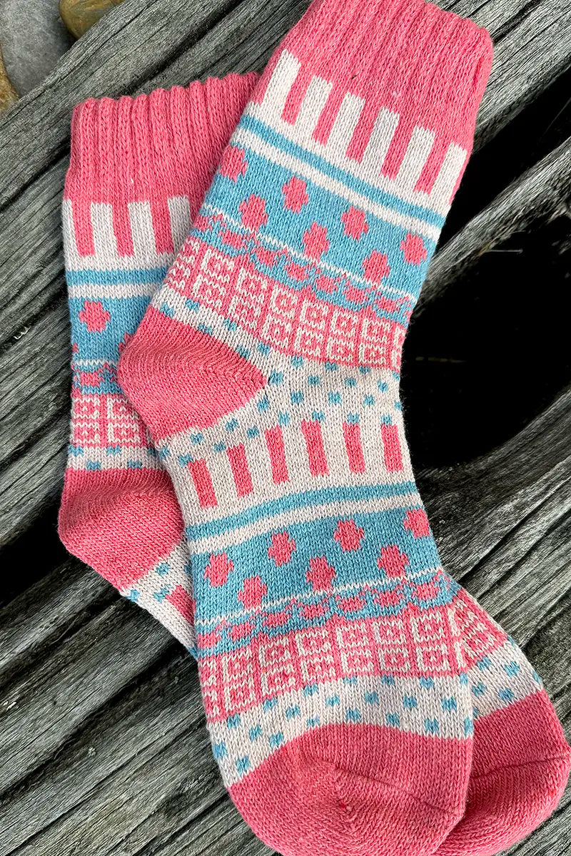 Nordic Style Socks in Pink Cross by Mabel + Meg on the drift wood