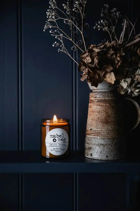 Scented Candle by Mabel + Meg in Beach House Classic sitting on the shelf with a rustic antique jug