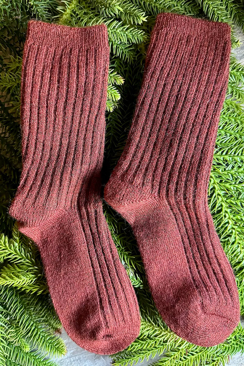 Wool Blend Crew Socks in Dark Rust by Mabel + Meg pair on bed of pine needles