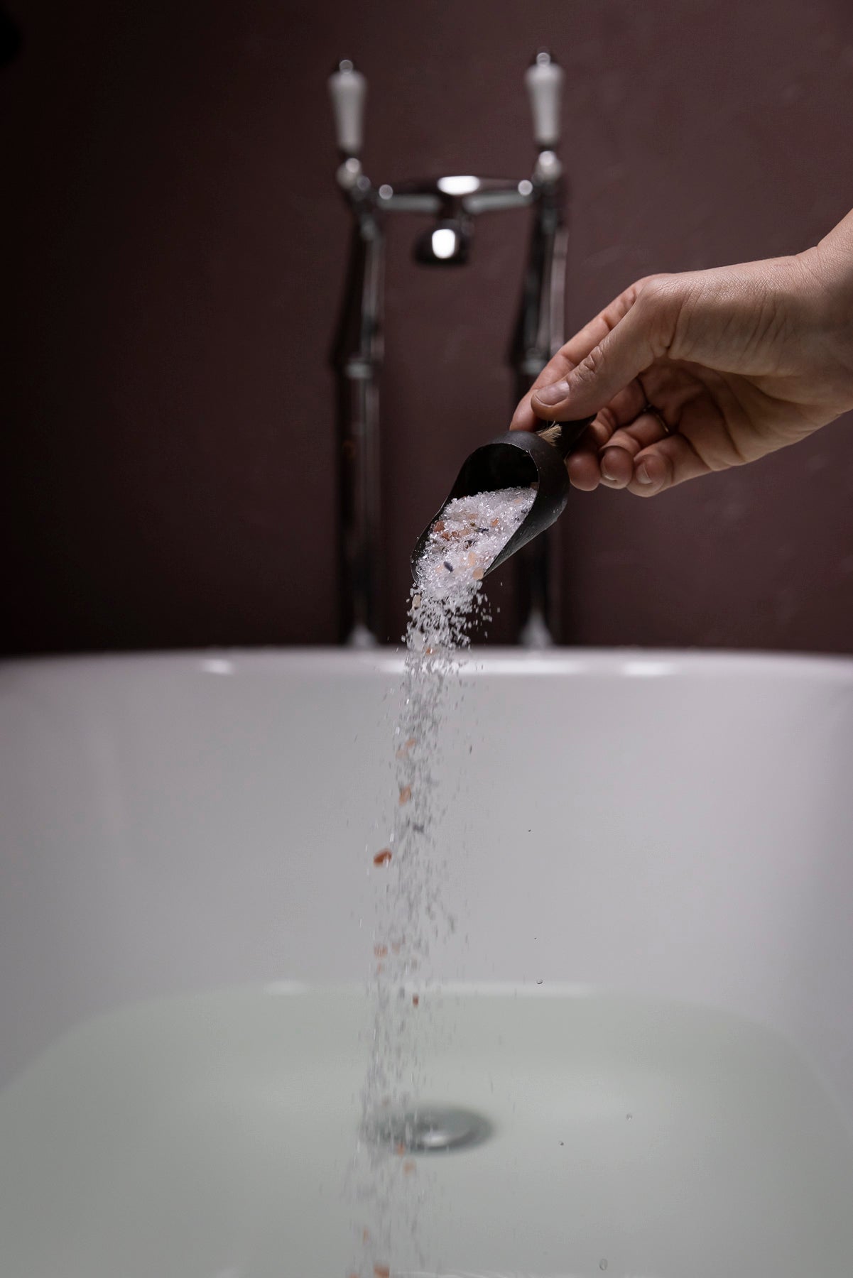 mabel + meg Fields of Tasmania bath salt being poured into a bath