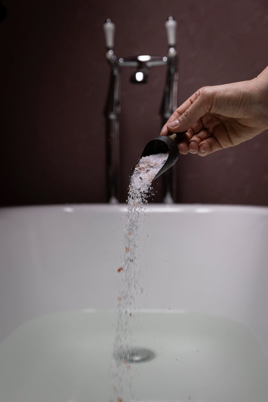 mabel + meg Fields of Tasmania bath salt being poured into a bath